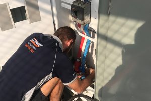 Switchboard upgrade technician servicing board from Brisbane Power Electricians